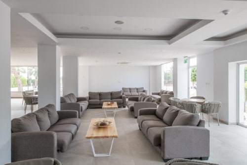 Lounge area at Panthea Holiday Village in Ayia Napa, Cyprus. Travel with World Lifetime Journeys