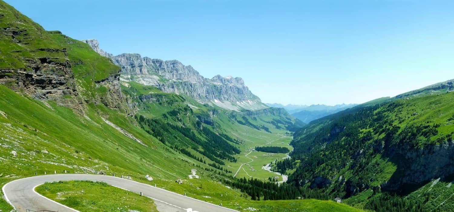 Road winding through Switzerland. Travel with World Lifetime Journeys