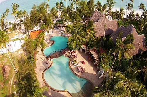 Air view of the pool and hotel at Palumbo Reef, Zanzibar. Travel with World Lifetime Journeys