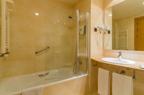 Ensuite bathroom at Golden Bahia de Tossa and Spa in Tossa de Mar, Spain. Travel with World Lifetime Journeys