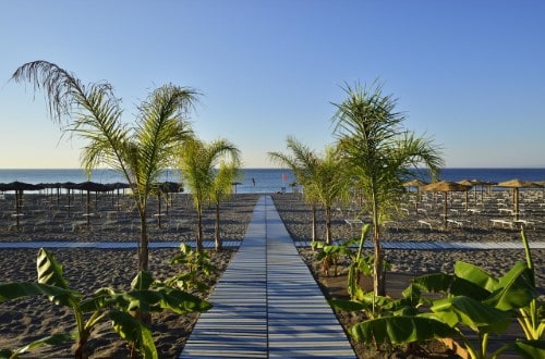 Beach front at UNAHOTELS Naxos Beach in Taormina, Sicily. Travel with World Lifetime Journeys
