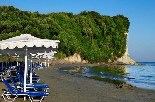 Beach side at Roda Beach Resort & Spa in Corfu, Greece. Travel with World Lifetime Journeys