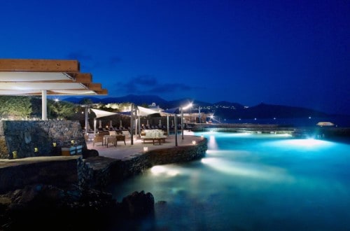 Beautiful evening view at St. Nicolas Bay Resort Hotel & Spa in Agios Nikolaos, Crete. Travel with World Lifetime Journeys