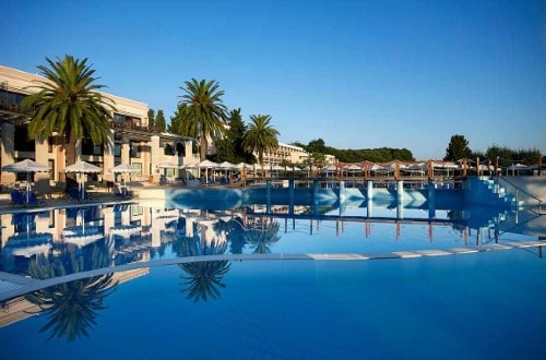Beautiful pool view at Roda Beach Resort & Spa in Corfu, Greece. Travel with World Lifetime Journeys