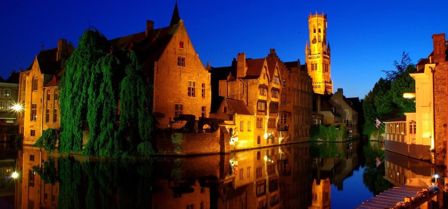 Bruges historic centre by night. Travel with World Lifetime Journeys