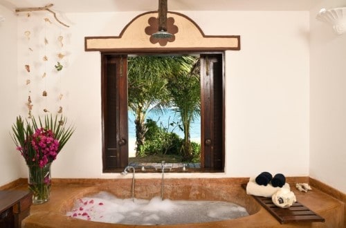 Bubbly bath at Fumba Beach Lodge, Zanzibar. Travel with World Lifetime Journeys