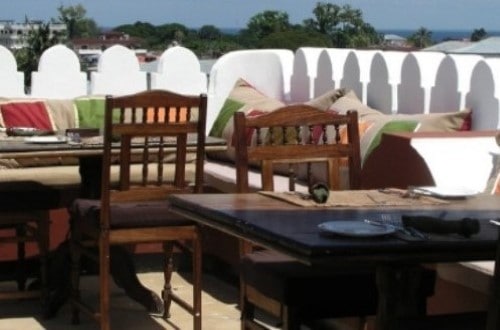 Dining on the terrace at Swahili House, Zanzibar. Travel with World Lifetime Journeys