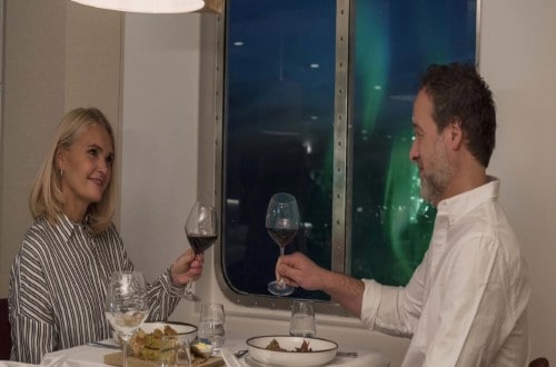 Dinner under the Northern Lights on Norway Voyages. Travel with World Lifetime Journeys