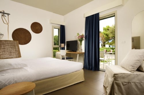Double bedroom at UNAHOTELS Naxos Beach in Taormina, Sicily. Travel with World Lifetime Journeys