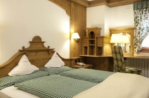 Double room at Chalet Barbara in Arabba, Italy. Travel with World Lifetime Journeys