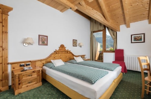 Double room at Chalet Barbara in Arabba, Italy. Travel with World Lifetime Journeys