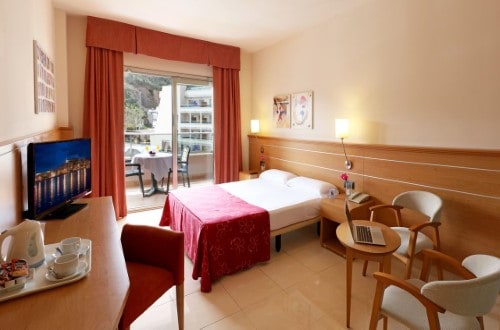 Double room at Golden Bahia de Tossa and Spa in Tossa de Mar, Spain. Travel with World Lifetime Journeys