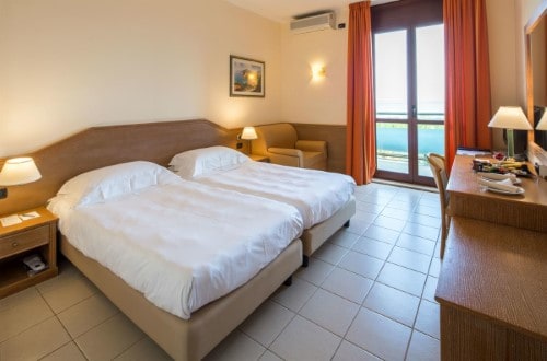 Double room at UNAHOTELS Naxos Beach in Taormina, Sicily. Travel with World Lifetime Journeys