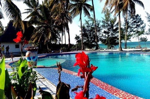 Enjoy a swim at Mermaids Cove Beach Resort and Spa, Zanzibar. Travel with World Lifetime Journeys