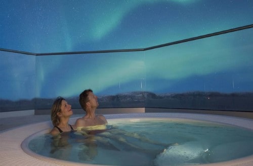 Enjoy the Northern Lights from a Jacuzzi on Norway Voyages. Travel with World Lifetime Journeys