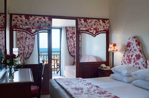 Family room at Roda Beach Resort & Spa in Corfu, Greece. Travel with World Lifetime Journeys