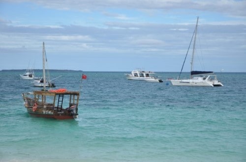 Fishing boats at Sunset Kendwa in Zanzibar. Travel with World Lifetime Journeys