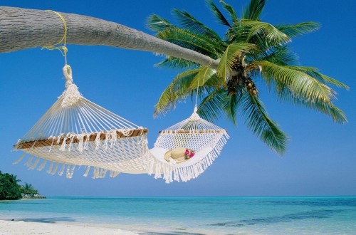 Hammock relaxation at Palumbo Reef, Zanzibar. Travel with World Lifetime Journeys