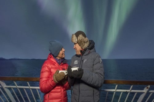 Have a hot drink under the Northern Lights on Norway Voyages. Travel with World Lifetime Journeys