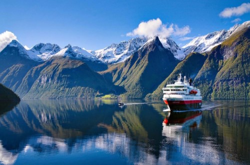 Hjørundfjorden. We visit this spectacular fjord in the autumn months (Sept-Oct) on Norway Voyages. Travel with World Lifetime Journeys