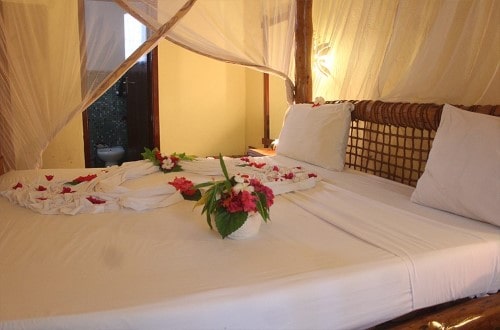 Honeymoon bedroom at Samaki Lodge, Zanzibar. Travel with World Lifetime Journeys