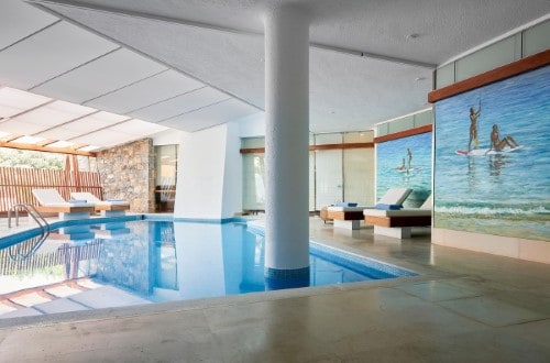 Indoor pool at St. Nicolas Bay Resort Hotel & Spa in Agios Nikolaos, Crete. Travel with World Lifetime Journeys