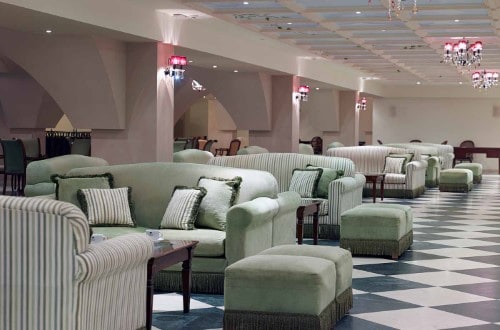 Lounge area at Roda Beach Resort & Spa in Corfu, Greece. Travel with World Lifetime Journeys