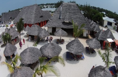 Lounges and umbrellas on the beach at Palumbo Kendwa, Zanzibar. Travel with World Lifetime Journeys