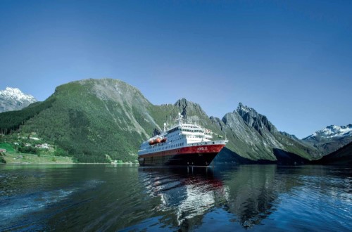 MS Nordlys at Hjørundfjord on Northern Lights round voyage. Travel with World Lifetime Journeys