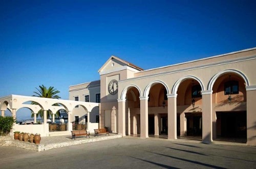 Main entrance at Roda Beach Resort & Spa in Corfu, Greece. Travel with World Lifetime Journeys