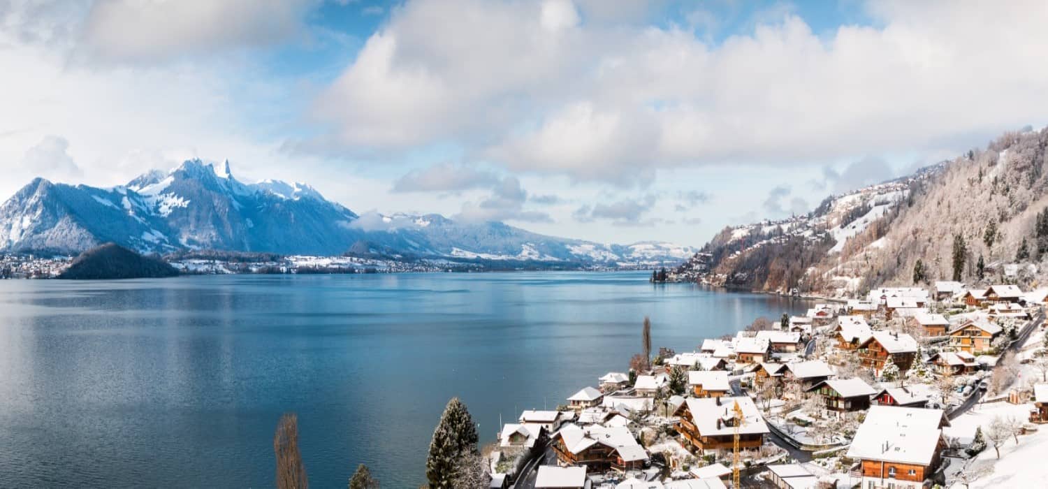 Merligen village and lake in Switzerland. Travel with World Lifetime Journeys