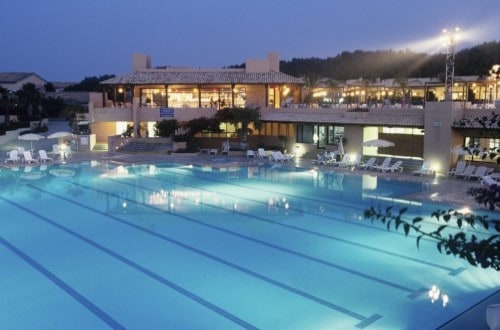 Night view of the pool at Club Med Kamarina Bungalows, Sicily. Travel with World Lifetime Journeys