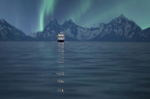 Northern Lights flashing in northern Norway, above MS Spitsbergen on Northern Lights round voyage. Travel with World Lifetime Journeys