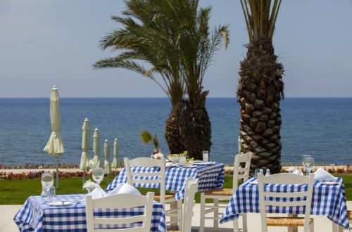 Outdoor restaurant at King Evelthon Beach Hotel on Paphos, Cyprus. Travel with World Lifetime Journeys