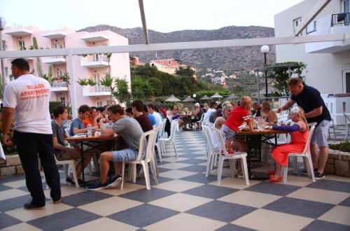 Outside restaurant at Bellos Hotel Apartments in Crete, Greece. Travel with World Lifetime Journeys