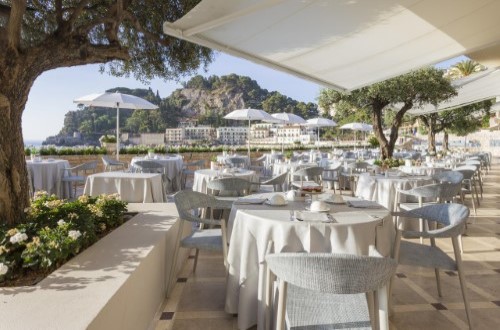 Outside terrace at Grand Hotel Mazzaro Sea Palace in Taormina, Sicily. Travel with World Lifetime Journeys