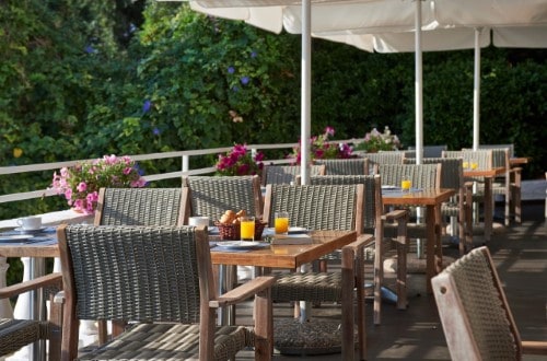 Outside terrace at Primasol Ionian Sun in Corfu, Greece. Travel with World Lifetime Journeys