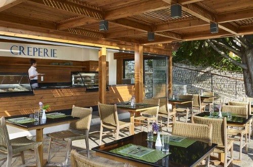 Outside terrace at Roda Beach Resort & Spa in Corfu, Greece. Travel with World Lifetime Journeys
