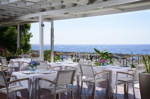 Outside terrace at UNAHOTELS Naxos Beach in Taormina, Sicily. Travel with World Lifetime Journeys
