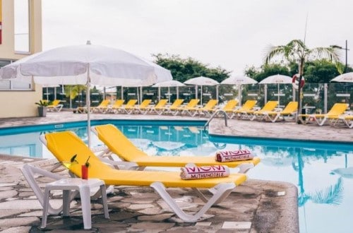 Pool and lounges at Muthu Raga Madeira Hotel in Madeira, Portugal. Travel with World Lifetime Journeys