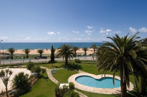 Pool and sea at Vila Gale Ampalius Hotel in Vilamoura on Algarve coast, Portugal. Travel with World Lifetime Journeys