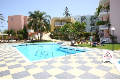 Pool side at Bellos Hotel Apartments in Crete, Greece. Travel with World Lifetime Journeys