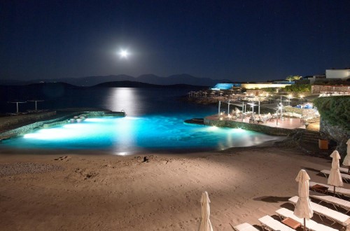 Private beach at St. Nicolas Bay Resort Hotel & Spa in Agios Nikolaos, Crete. Travel with World Lifetime Journeys