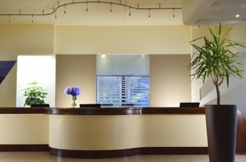 Reception area at UNAHOTELS Naxos Beach in Taormina, Sicily. Travel with World Lifetime Journeys