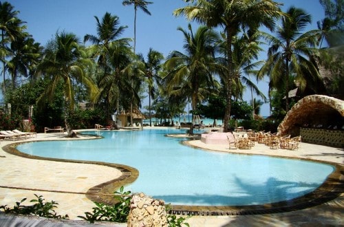 Relax at the pool at Palumbo Reef, Zanzibar. Travel with World Lifetime Journeys