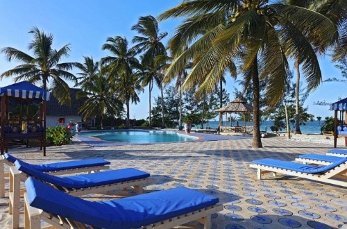 Relax by pool at Mermaids Cove Beach Resort and Spa, Zanzibar. Travel with World Lifetime Journeys