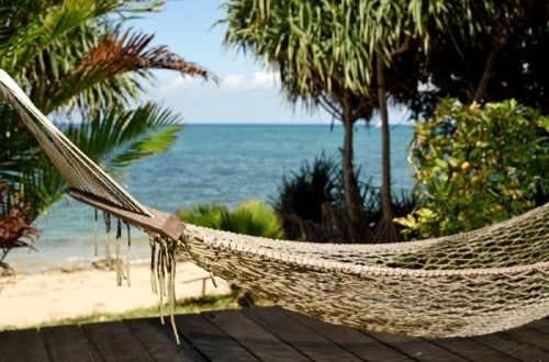 Relax in hammock at Fumba Beach Lodge, Zanzibar. Travel with World Lifetime Journeys