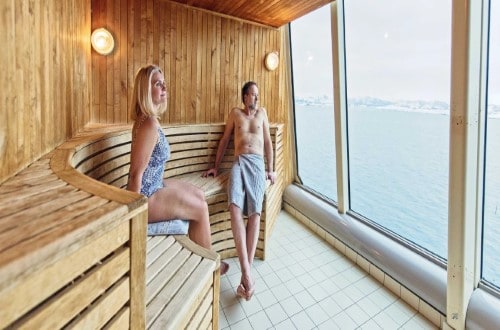 Relax in the sauna with a view on MS Trollfjord on Northern Lights round voyage. Travel with World Lifetime Journeys