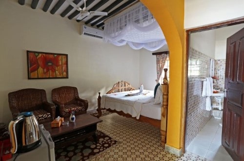 Romantic bedroom at Mermaids Cove Beach Resort and Spa, Zanzibar. Travel with World Lifetime Journeys