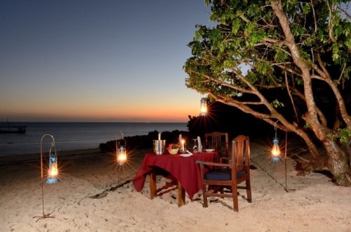 Romantic dinner at Fumba Beach Lodge, Zanzibar. Travel with World Lifetime Journeys